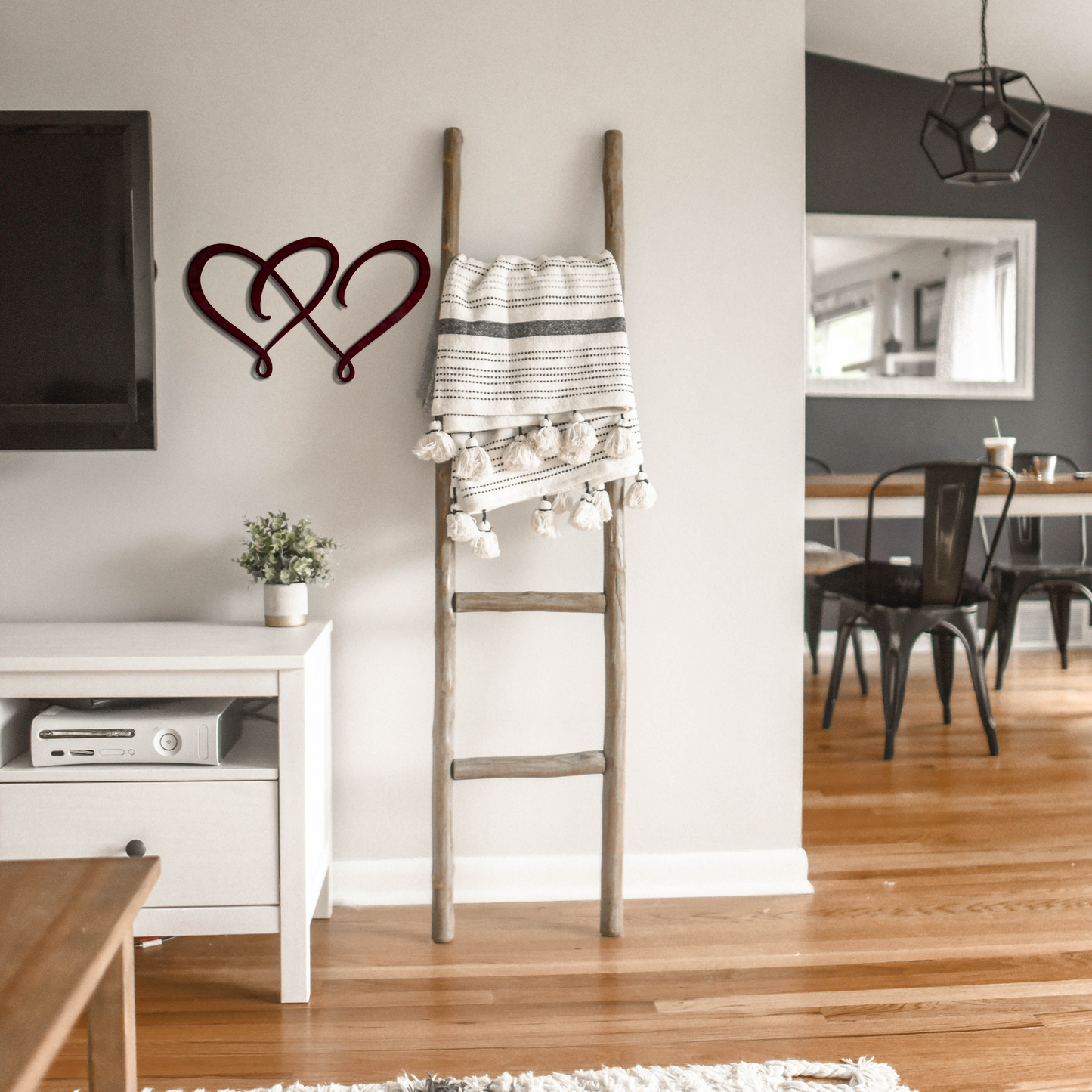 double heart metal wall art next to a latter badger steel usa