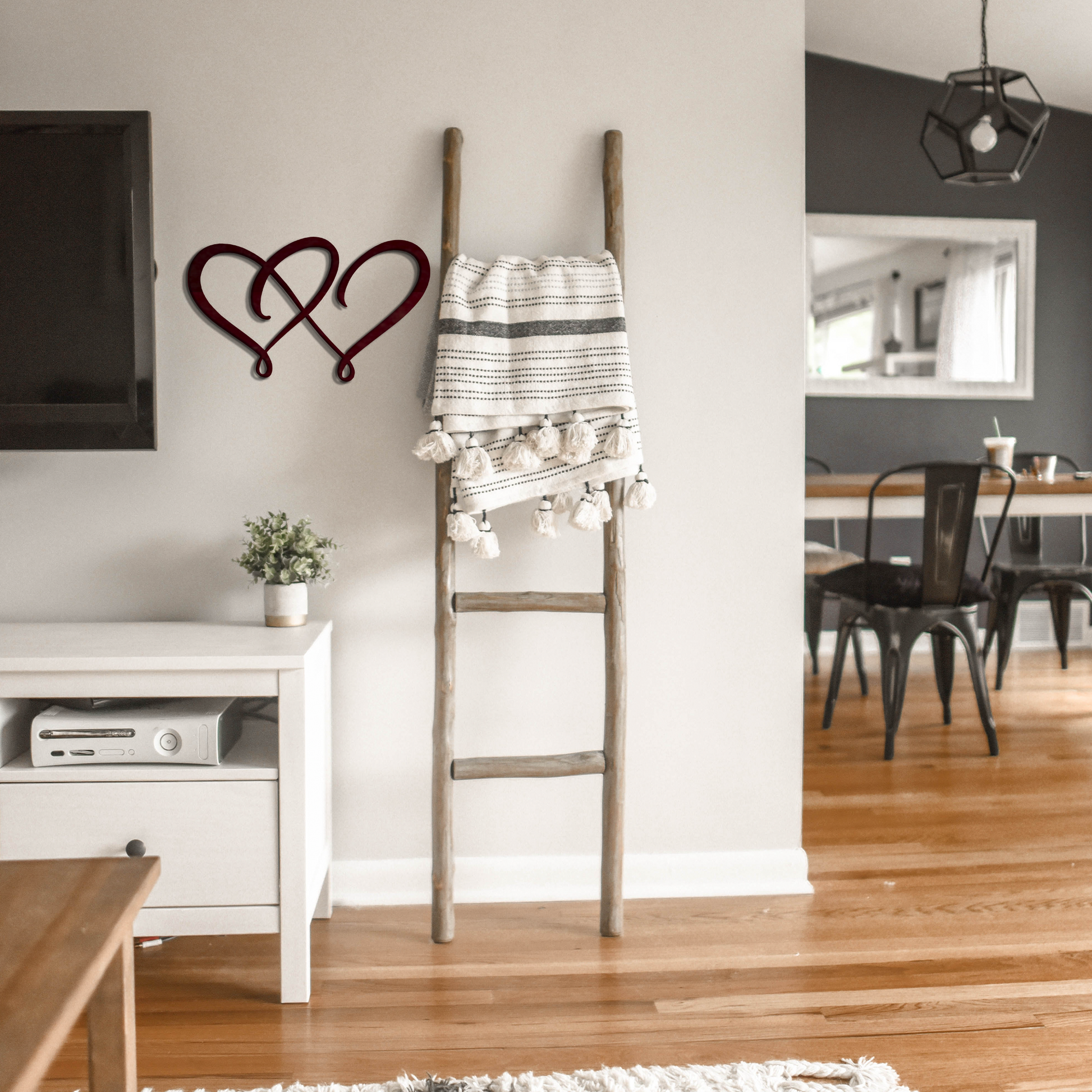 double heart metal wall art next to a latter badger steel usa