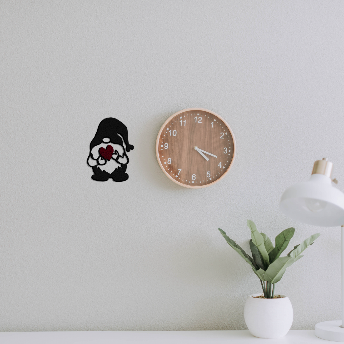 gnome heart metal wall art next to a clock badger steel usa