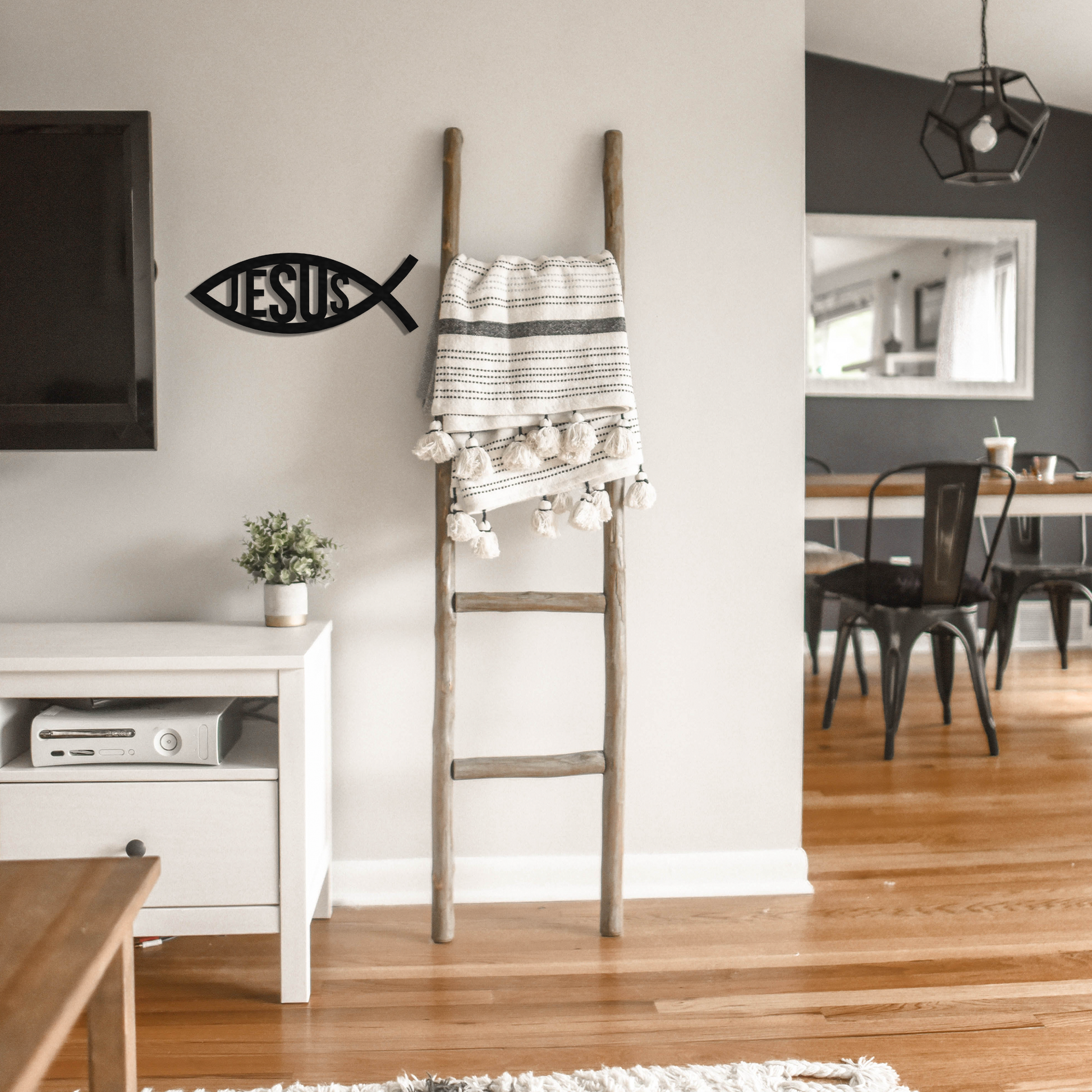 jesus fish metal wall art next to a latter badger steel usa
